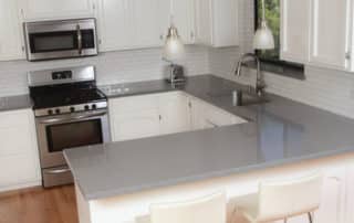 Classic White Domestic Kitchen with Subway Tile and Quartz